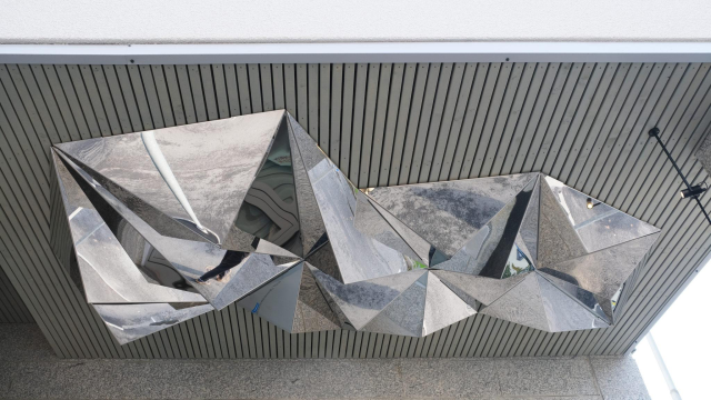 Milla Vuorinen: Porigami, 2020. Photo: Milla Vuorinen Mirrored multi-sided origami-like sculpture on the inner surface of a roof.